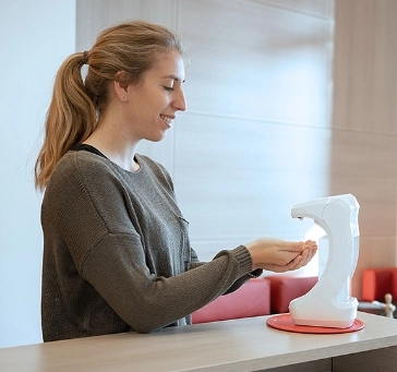 Woman using RX dispenser